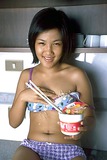 Asian slut drops noodles all over her hairy gash