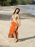 Sensual Asian Ming teasing us with her perky boobies on the beach