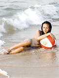 Ultra sexy Asian babe Mai showing her divine breasts on the beach