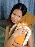 Tiny tit Asian spreads her puffy brown pussy lips