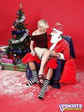 Short haired blondie in skirt gets undressed by Santa and mouth drilled