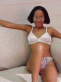 Chocolate slutty girl gets facialized with her eyeglasses on